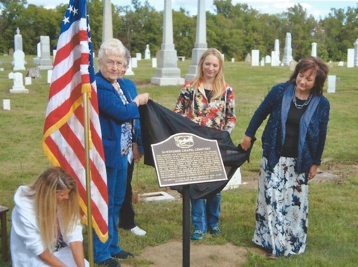 ETHS board members Viola Williams, Carmony Goecke, and Melissa Duer unveil historic marker at McKendree Chapel Cemetery in September of 2014